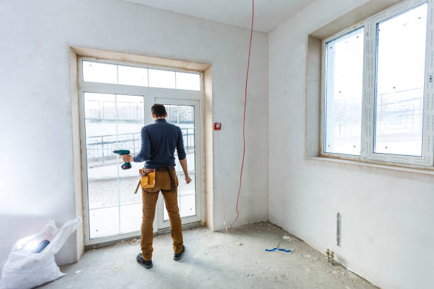 istock Worker in glazier's workshop, warehouse or storage handling glass 1208208108