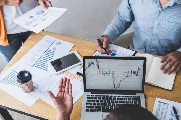 istock Business team collaboration discussing working analyzing with financial data and marketing growth report graph in team, presentation and brainstorming to strategy planning making profit of company 1208208514