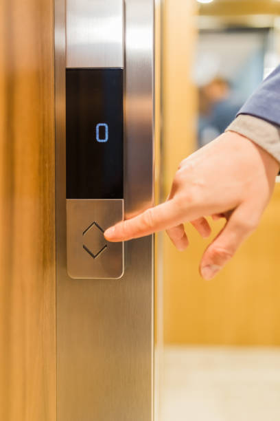 istock Man forefinger pressing up or down elevator button. Business success or failure concept. 1208209310