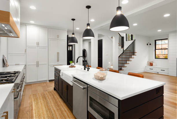 Beautiful white kitchen with dark accents in new farmhouse style luxury home kitchen in newly constructed luxury home farmhouse stock pictures, royalty-free photos & images
