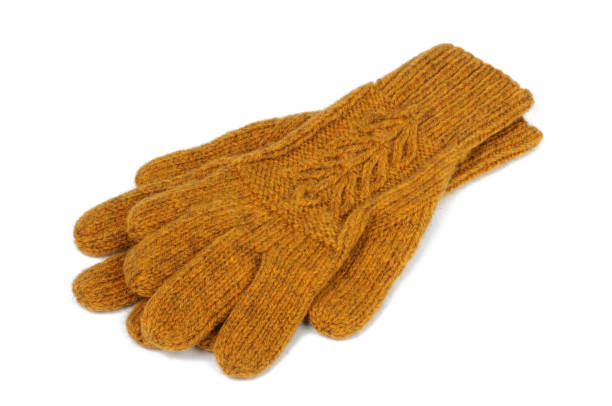 istock Yellow knitted gloves on a white background. View from above. 1208211803