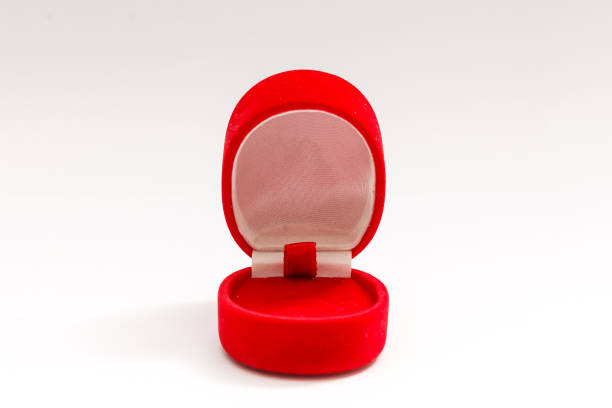 istock Red velvet box for the ring, opened, isolated over the white background 1208211845