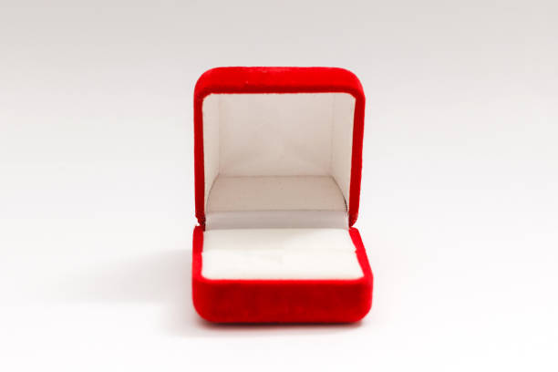 istock Red velvet box for the ring, opened, isolated over the white background 1208211910