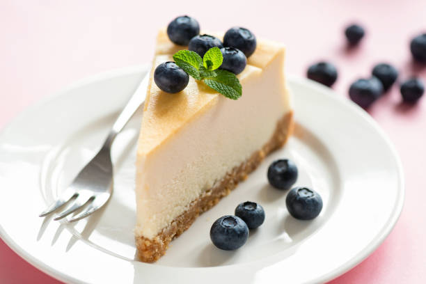 istock Classical Cheesecake Slice Served With Fresh Blueberries And Mint Leaf 1208211979