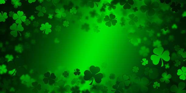 istock St Patrick's day illustration, clover leafs rotating on the green background 1208213542