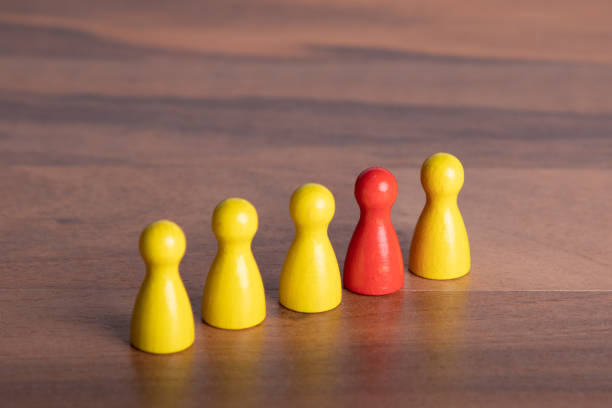 istock wooden figurines for a team including an other opinion 1208215935