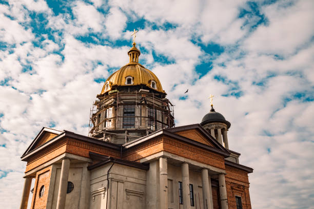 istock nowadays orthodox church building construction facade religion architecture stone and concrete walls exterior with pillars and gold dome photography foreshortening from below on cloudy blue sky space 1208215998