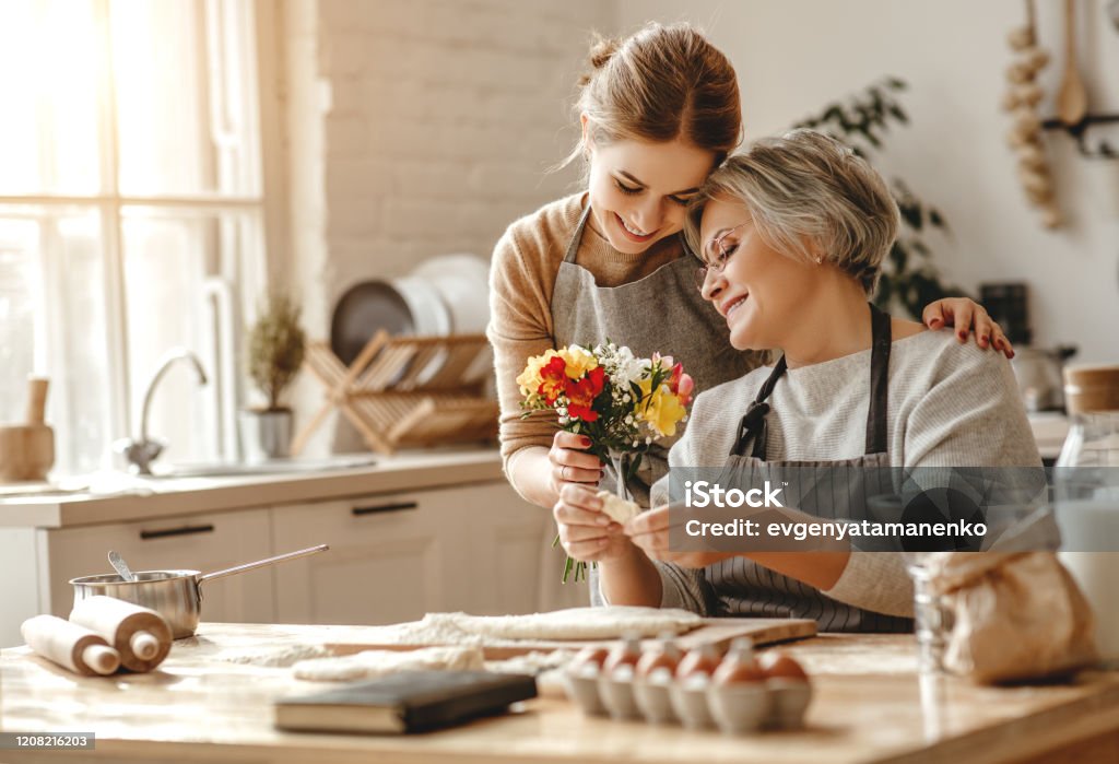 happy mother's day! family old grandmother  mother-in-law and daughter-in-law daughter congratulate on   holiday, give flowers happy mother's day! family old grandmother mother-in-law and daughter-in-law daughter congratulate on the holiday, give flowers Mother Stock Photo