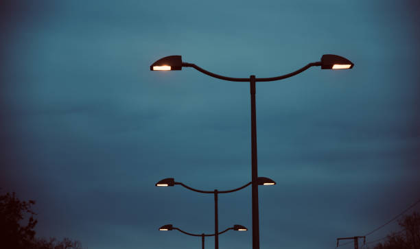 istock Traditional metallic street lampposts with sky background 1208217860