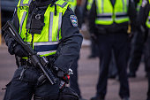 Riot policemen with gas gun