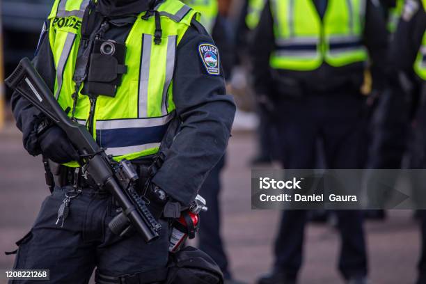 Riot Policemen With Gas Gun Stock Photo - Download Image Now - Police Force, USA, Protest