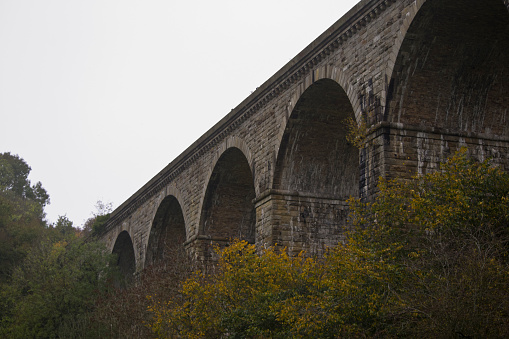 Brick aqueduct arches in Chirk, Wrexham, UK. Built in 1801 carrying the Llangollen canal across the Ceiriog valley.