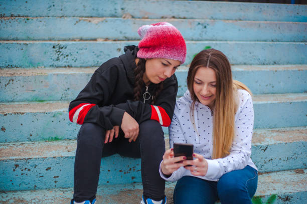 istock Girls in skate park 1208227961