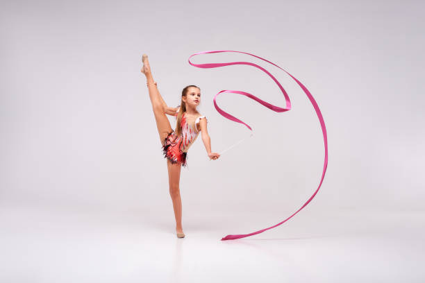 Training Is Your Performance Fulllength Shot Of Flexible Child Gymnast  Doing Acrobatic Exercise Using Ribbon Isolated On A White Background Sport  Rhythmic Gymnastics Active Lifestyle Concept Stock Photo - Download Image  Now 