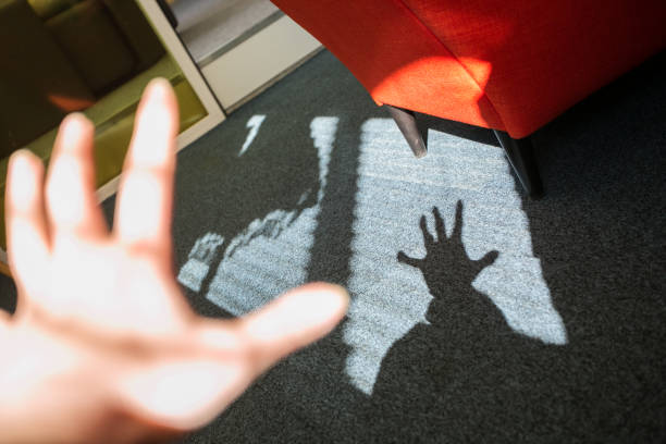 Playing shadow game in the office. Nice sunlight comming into office. stock photo
