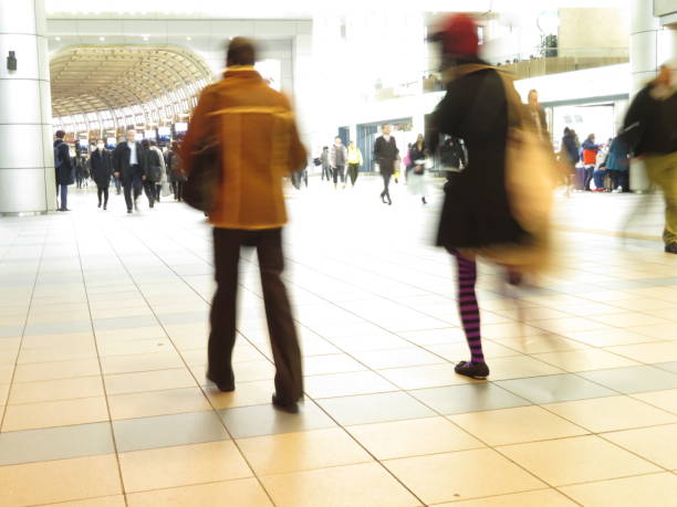 istock Commuting People in a station aisle 1208231677