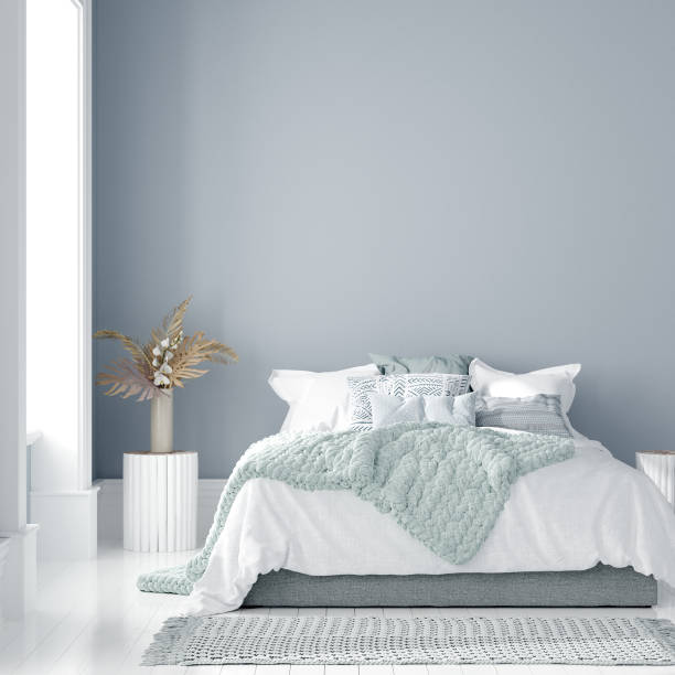 istock Home interior mock-up with bed, table and bouquet in bedroom 1208233069