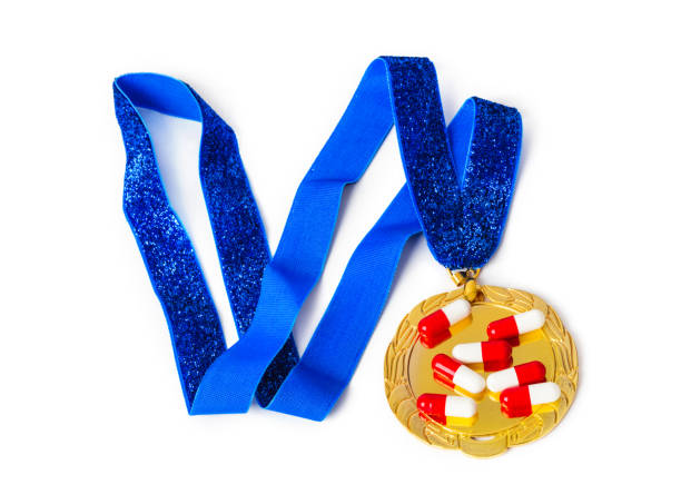 istock Gold medal and pills 1208234573