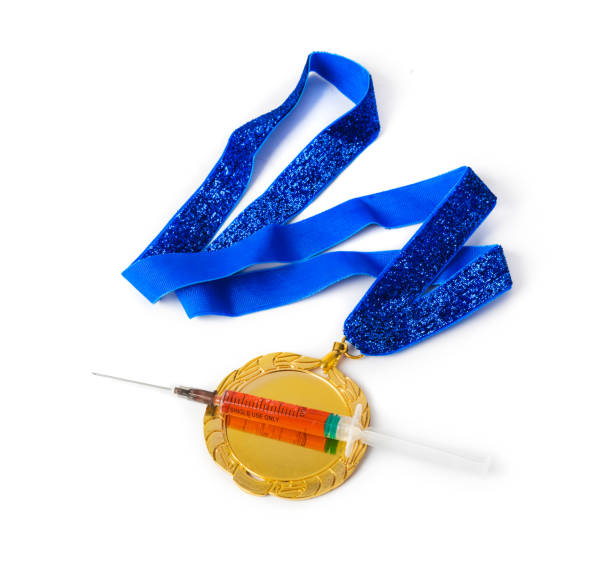 istock Gold medal and syringe 1208234584