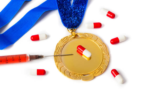 istock Gold medal with syringe and pills 1208234605