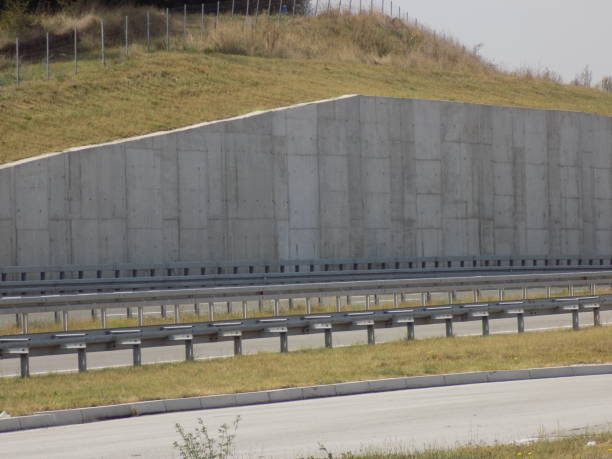 Concrete retaining wall and railing on the new road