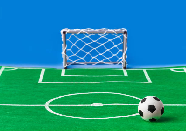 Toy football field and gate - sport background