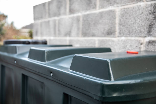 istock Central heating oil green plastic tank with internal bund and concrete base and isolation valve 1208238418