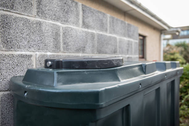 istock Central heating oil green plastic tank with internal bund and concrete base and isolation valve 1208239040