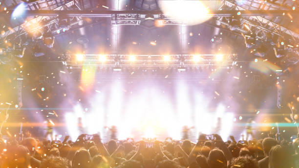istock Concert hall with people silhouettes 1208239271