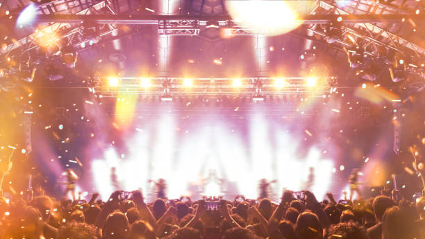 istock Concert hall with people silhouettes 1208239278