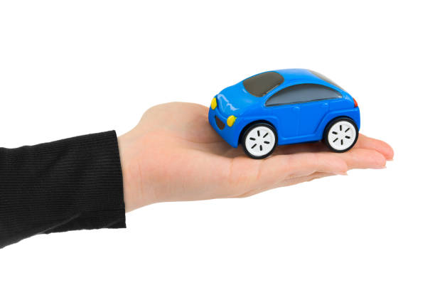 istock Hand and toy car 1208242825
