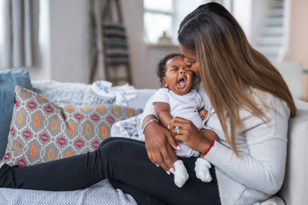 istock Indian mother consoling newborn baby 1208244840