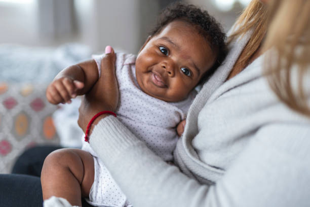 istock Happy baby in mother's arms 1208244845