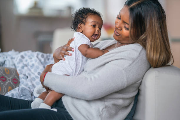 istock Happy baby in mother's arms 1208244848