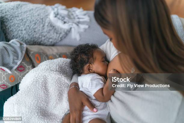 Breastfeeding Baby Stock Photo - Download Image Now - Breastfeeding, Newborn, Mother
