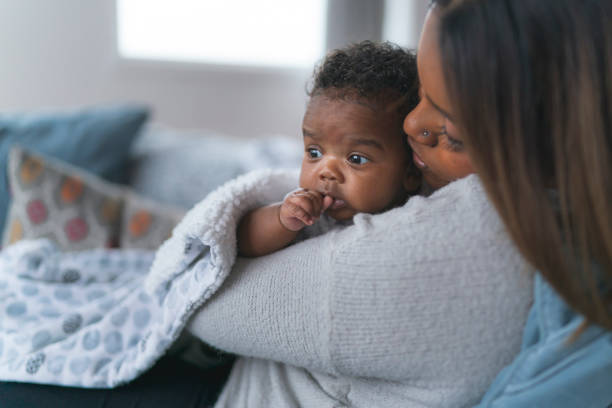 istock Mother kissing baby daughter 1208244876