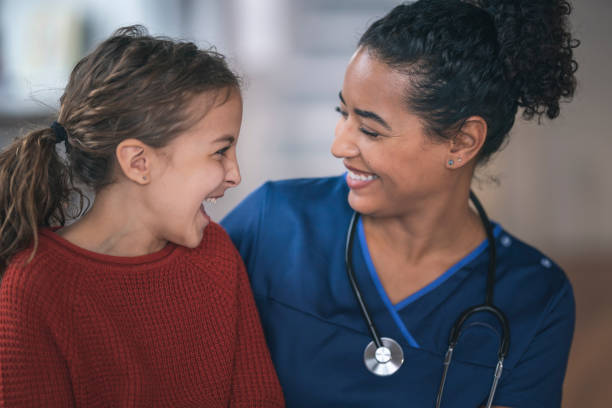 istock Female pediatrician with patient 1208245008