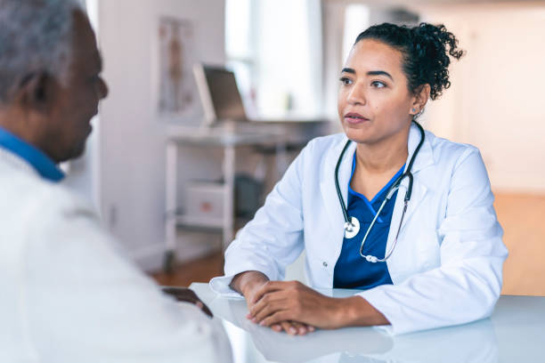 istock Physician meeting with senior patient 1208245023