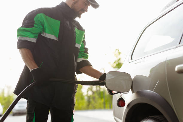 istock Crop employee refueling vehicle 1208245558