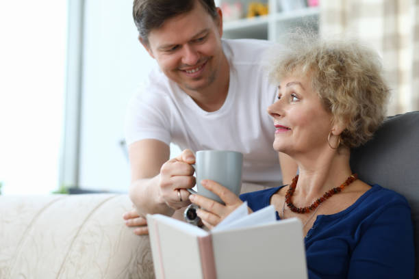 istock Son caring of aged mother 1208245663