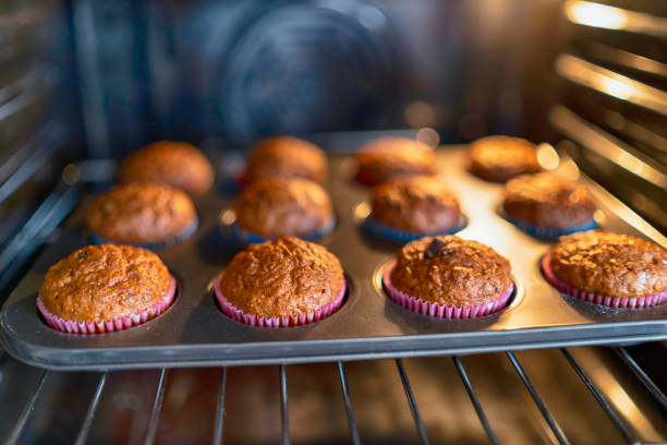 istock Tray  with muffins in oven 1208245671