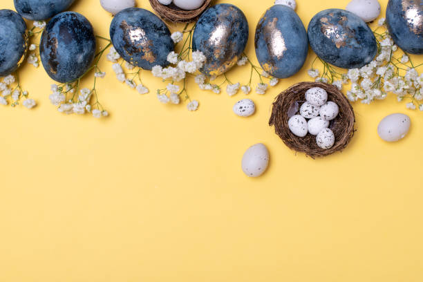 istock Flat Lay of Golden Easter Eggs in row placed on yellow background. Easter background or easter concept. 1208245898