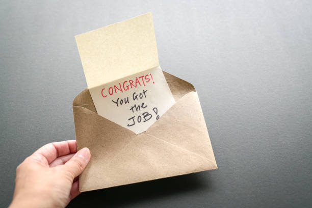 istock Congrats you got the job, a message inside a brown envelope 1208249971