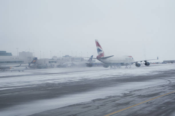 Denver, Colorado February 19, 2020: a British Airway plane taking off in bad wintery weather in Denver International Airport