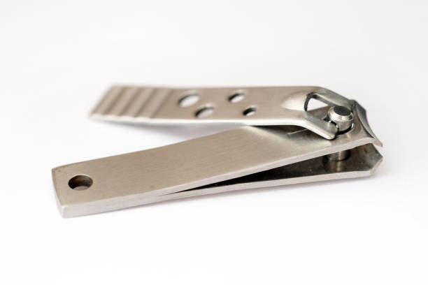 Knippers on a white background. Tool for nail care, for manicure and pedicure. Metal nippers side view.