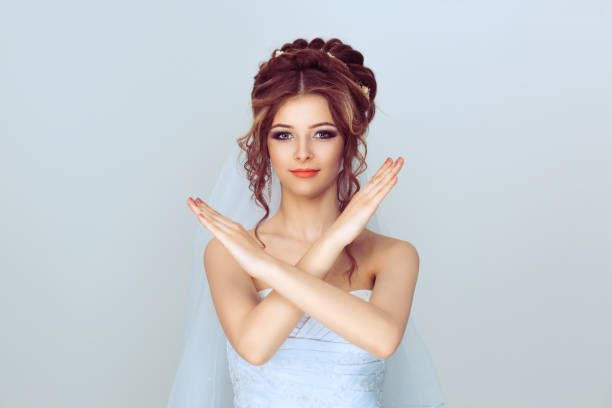 istock Bride woman doing stop it, no gesture with hands isolated on light blue 1208255620