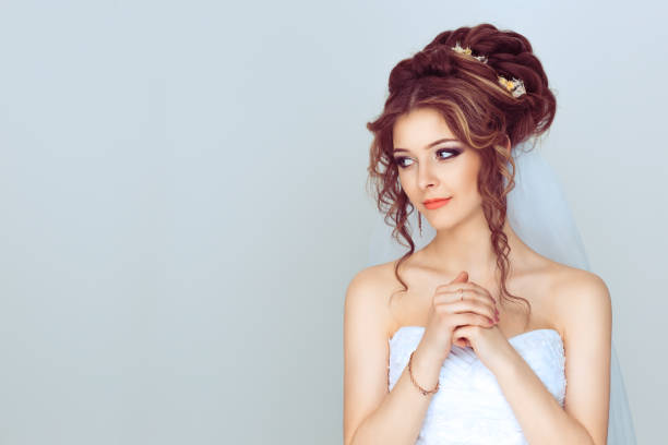 istock Girl bride showing clasped hands, pretty please isolated light blue white background. Human emotion facial expression feelings, body language 1208255760