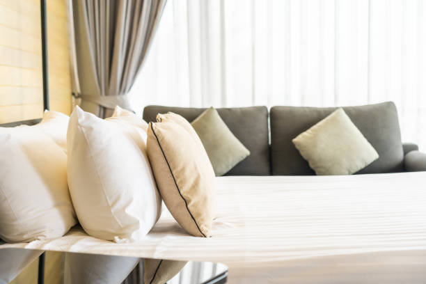 istock White comfortable pillow on bed decoration interior of bed room 1208261023