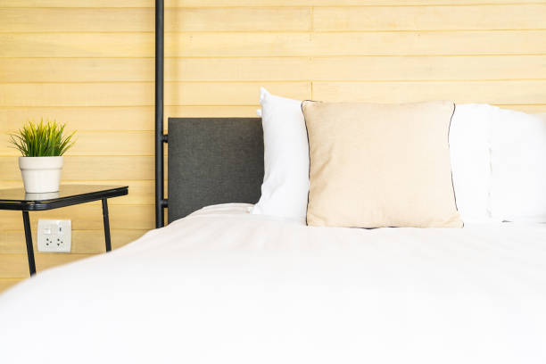 istock White comfortable pillow on bed decoration interior of bed room 1208261556