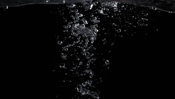 istock Bubbles underwater splashing and floating up and black color background which represent carbonate drink such as soda or cola and sparkling water from nature that can use for refreshing or freshing concept 1208266019